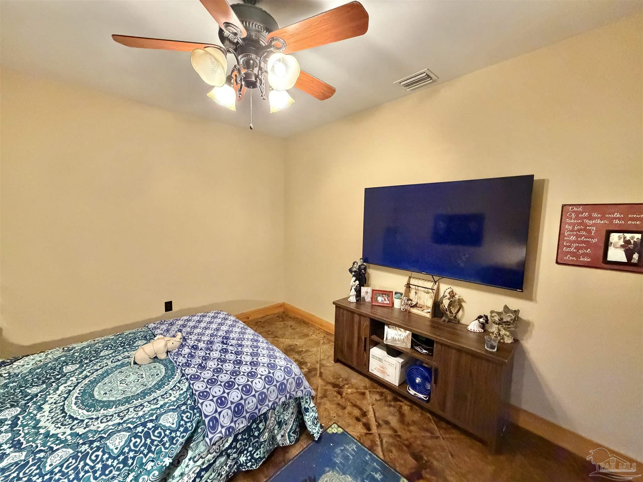 145 Tower Road Uriah, AL 36480 - Photo 19 of 72 a bedroom with a bed and a dresser