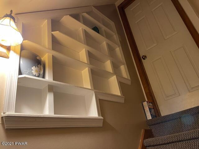 115 Koch Road Tafton, PA 18464 - Photo 34 of 42 SHELVES LOWER LEVEL STAIRCASE