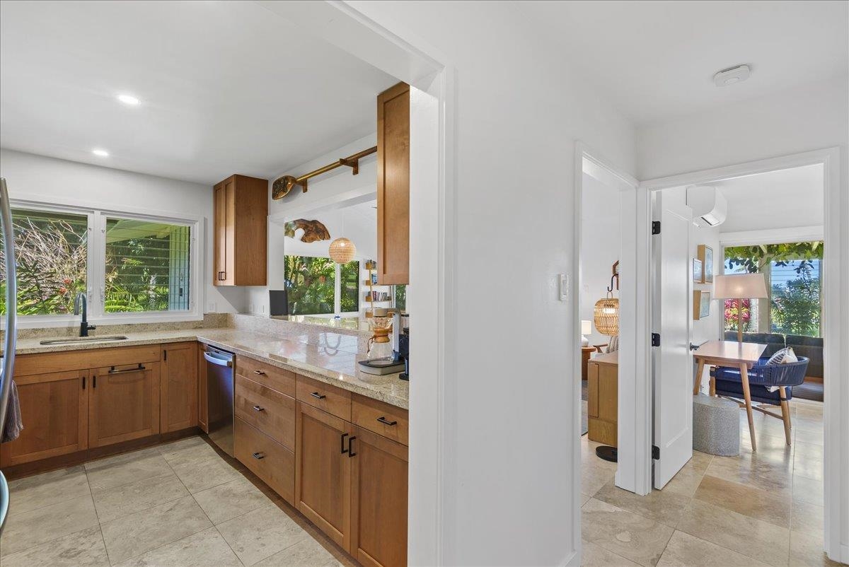 20 Hui Road East, Unit 37 Lahaina, HI 96761 - Photo 15 of 39 a large kitchen with a window and stainless steel appliances