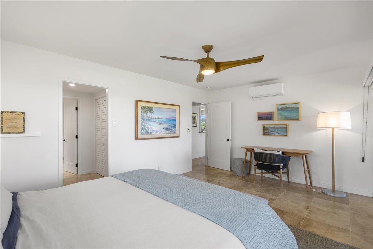 20 Hui Road East, Unit 37 Lahaina, HI 96761 - Photo 24 of 39 a bedroom with a bed and a table in it
