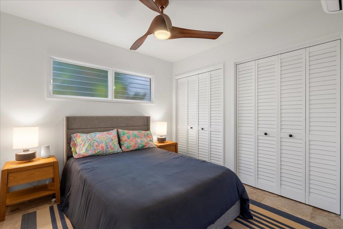 20 Hui Road East, Unit 37 Lahaina, HI 96761 - Photo 27 of 39 a bedroom with a bed and a closet