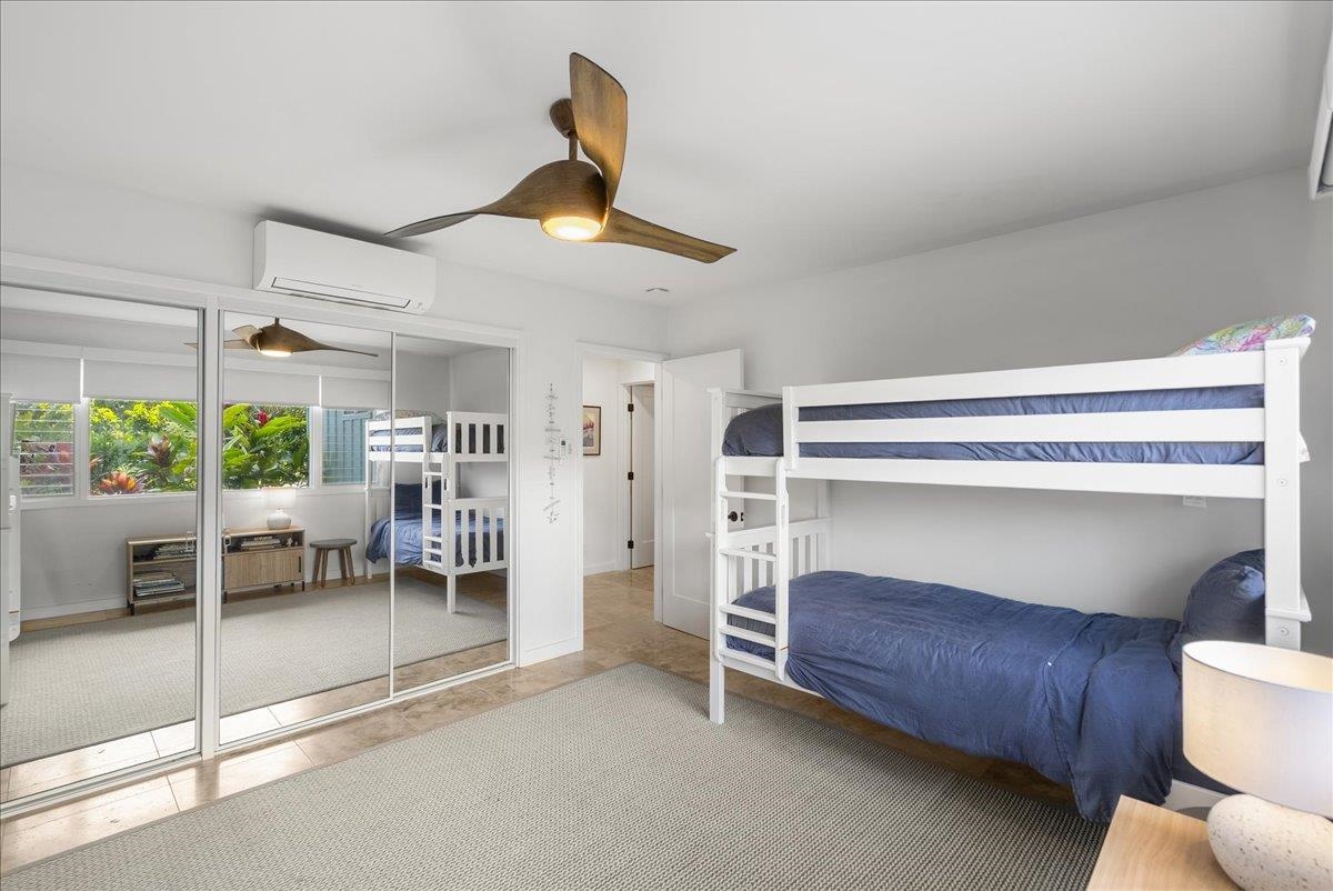 20 Hui Road East, Unit 37 Lahaina, HI 96761 - Photo 29 of 39 a bedroom with furniture and a large window