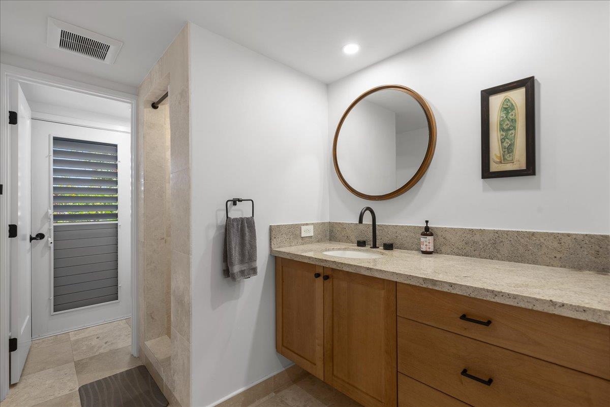 20 Hui Road East, Unit 37 Lahaina, HI 96761 - Photo 30 of 39 a bathroom with a granite countertop sink and a mirror