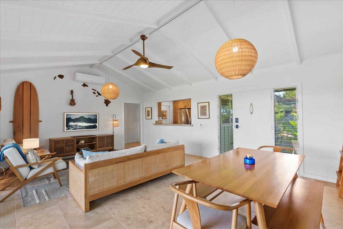 20 Hui Road East, Unit 37 Lahaina, HI 96761 - Photo 6 of 39 a living room with furniture a dining table and paintings on the wall
