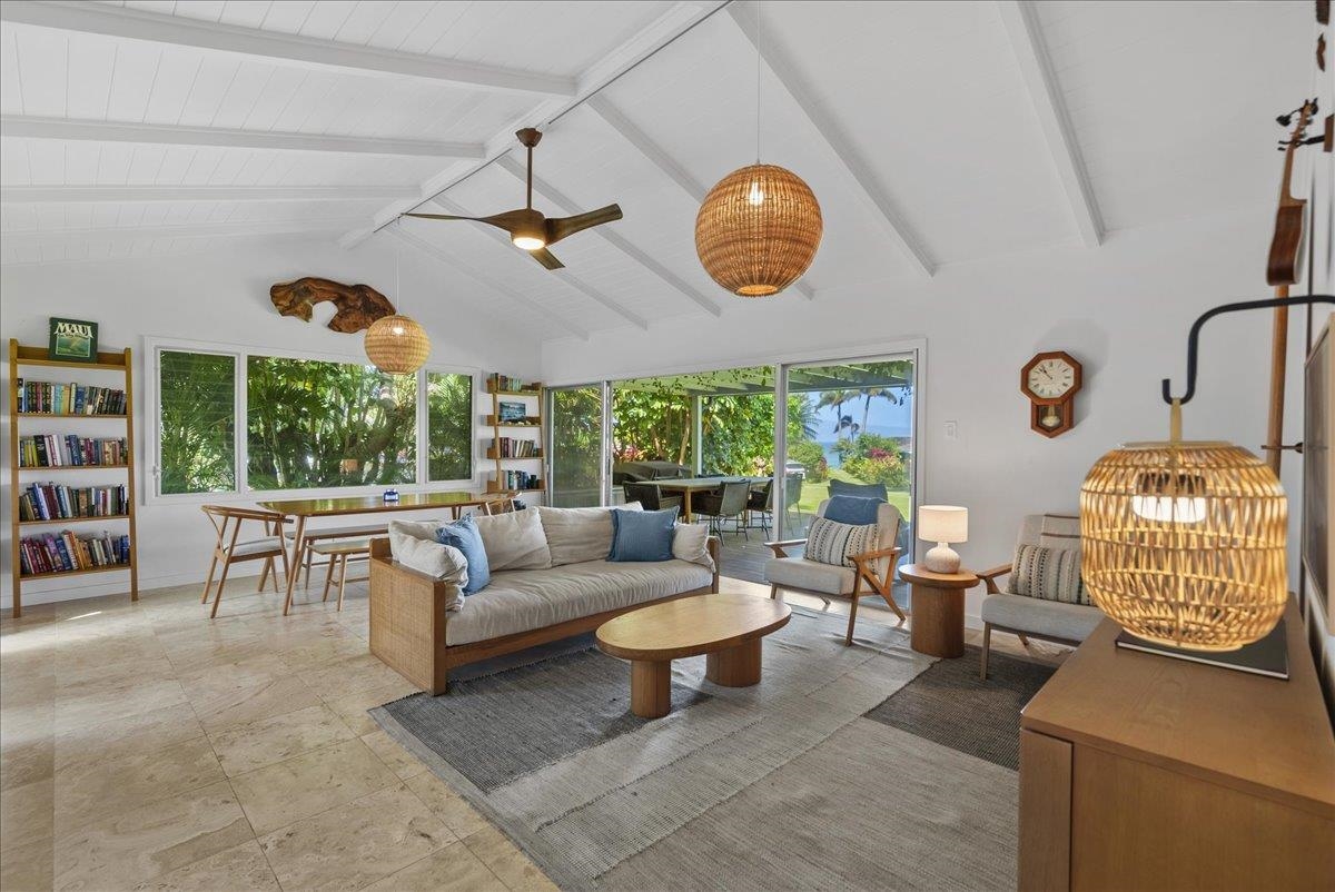20 Hui Road East, Unit 37 Lahaina, HI 96761 - Photo 10 of 39 a living room with furniture a chandelier and a large window