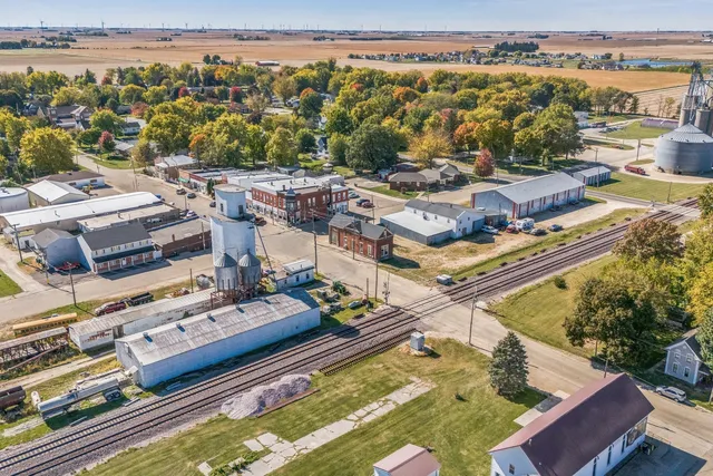 an aerial view of residential houses with outdoor space