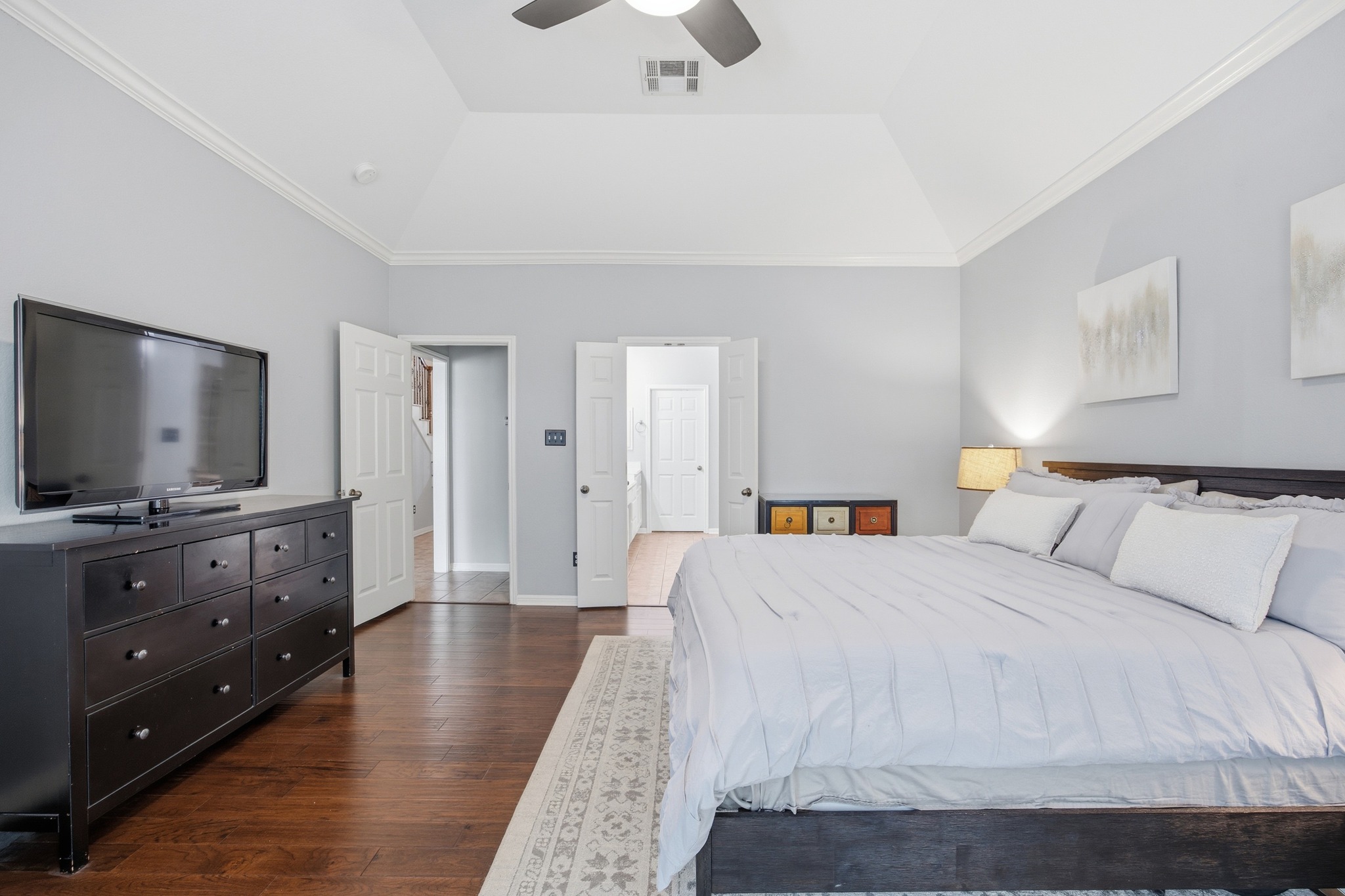 2204 Rio Mesa Drive Austin, TX 78732 - Photo 22 of 40 This room features hardwood flooring, a vaulted ceiling, and crown molding