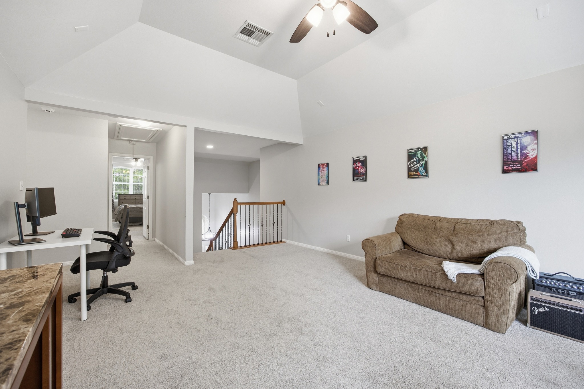 2204 Rio Mesa Drive Austin, TX 78732 - Photo 26 of 40 Spacious room featuring vaulted ceilings, light-colored carpeting, and a ceiling fan