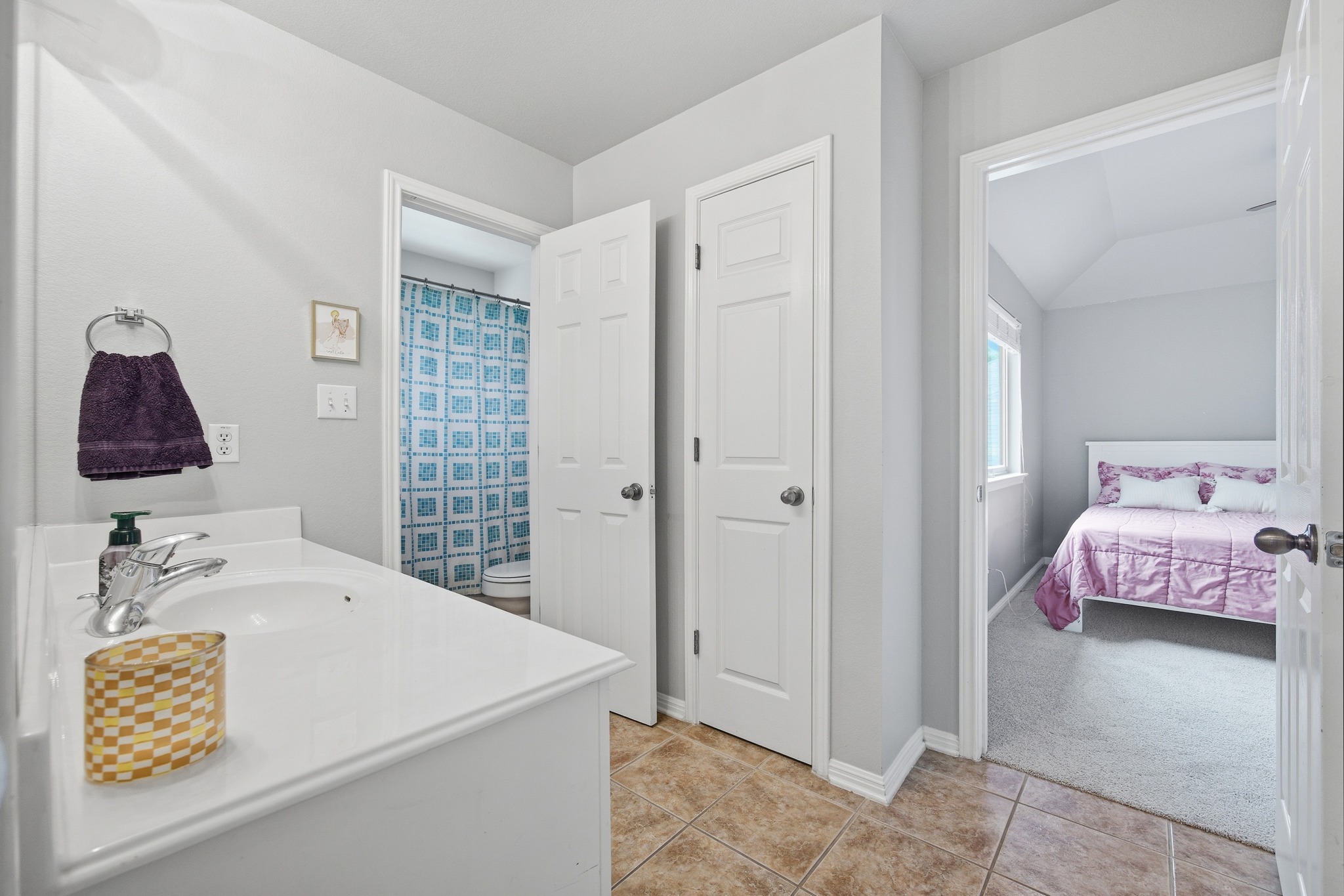 2204 Rio Mesa Drive Austin, TX 78732 - Photo 27 of 40 The bathroom features a vanity with a white countertop and an integrated sink, set against light gray walls