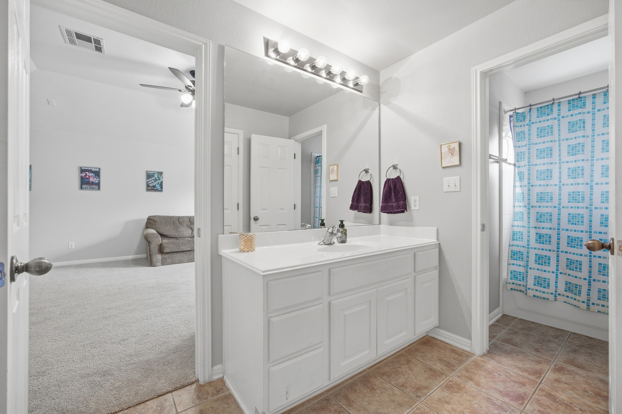 2204 Rio Mesa Drive Austin, TX 78732 - Photo 29 of 40 Bathroom featuring a white vanity with a single sink, an expansive mirror, and overhead lighting