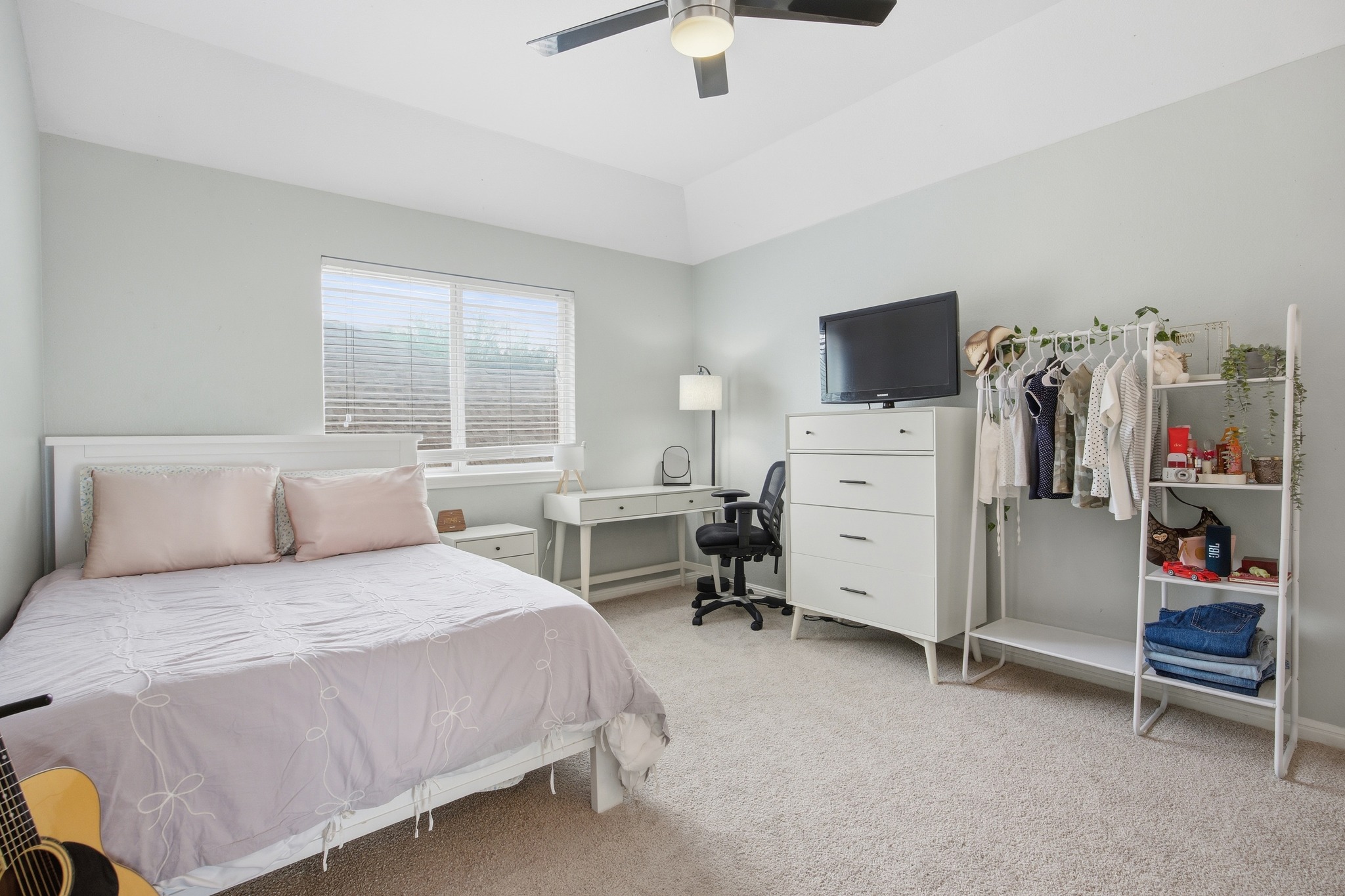 2204 Rio Mesa Drive Austin, TX 78732 - Photo 30 of 40 The property features a bedroom with neutral carpet, light-colored walls, and a window with blinds