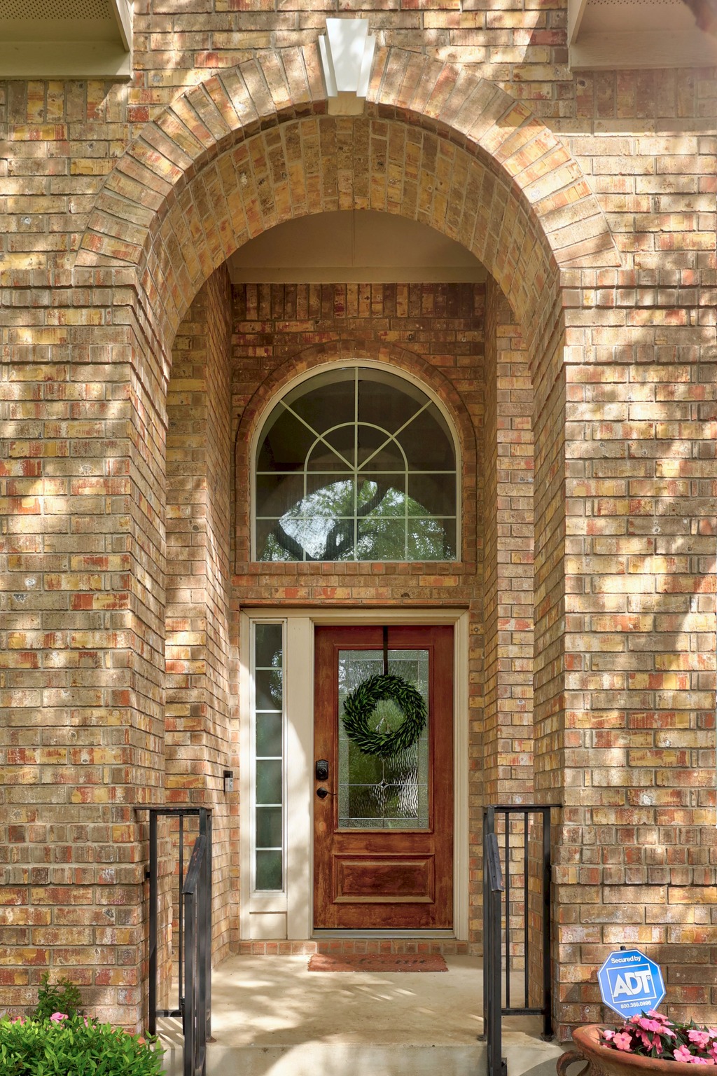 2204 Rio Mesa Drive Austin, TX 78732 - Photo 3 of 40 The property features a brick exterior with an arched entryway