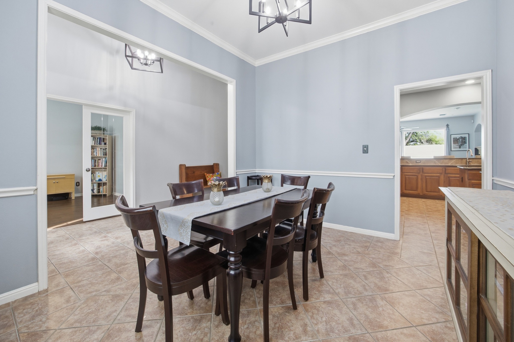 2204 Rio Mesa Drive Austin, TX 78732 - Photo 8 of 40 The property features tile flooring, light blue walls, and white crown molding