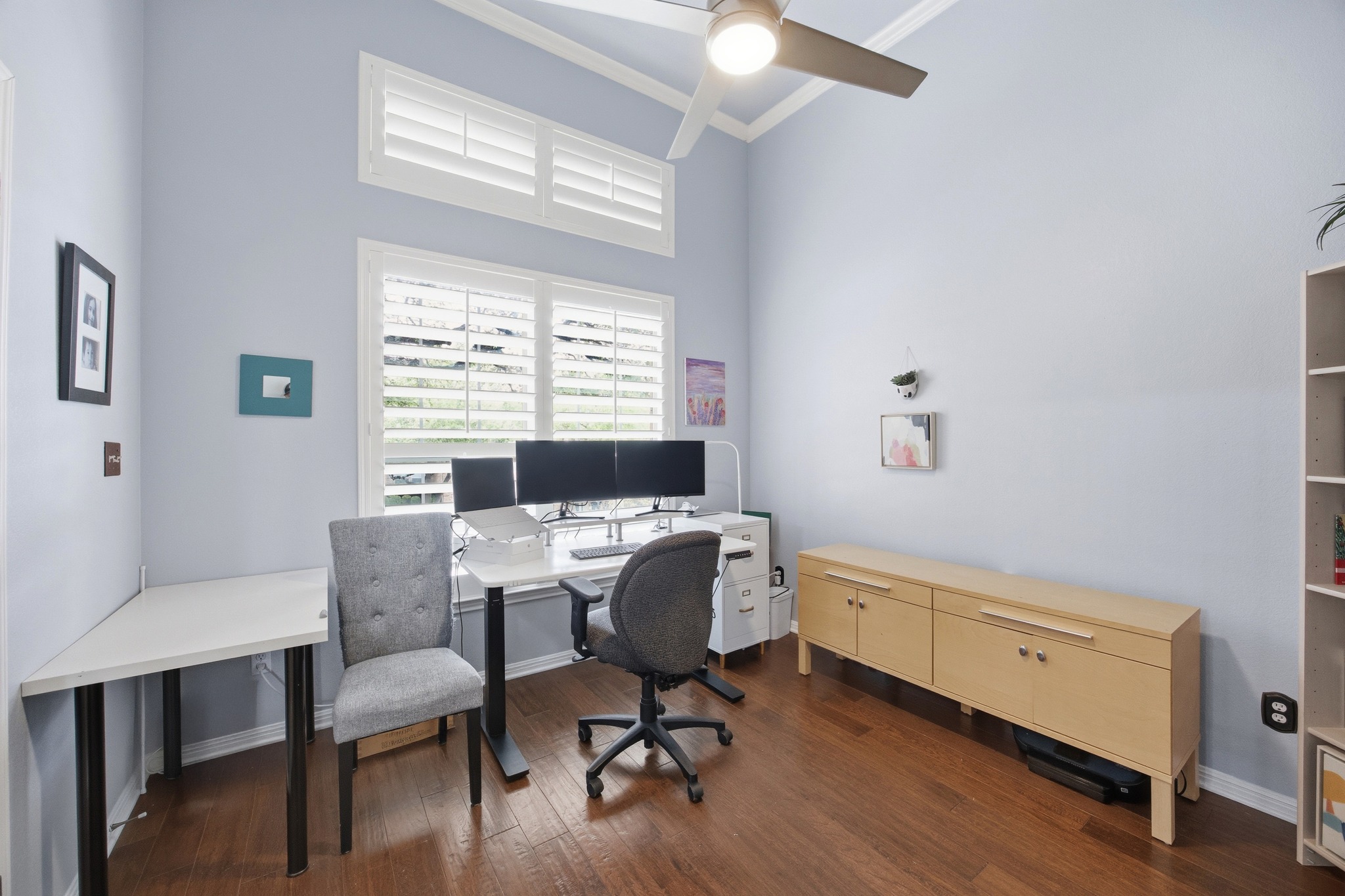 2204 Rio Mesa Drive Austin, TX 78732 - Photo 9 of 40 This room features hardwood floors, a ceiling fan, and windows with plantation shutters