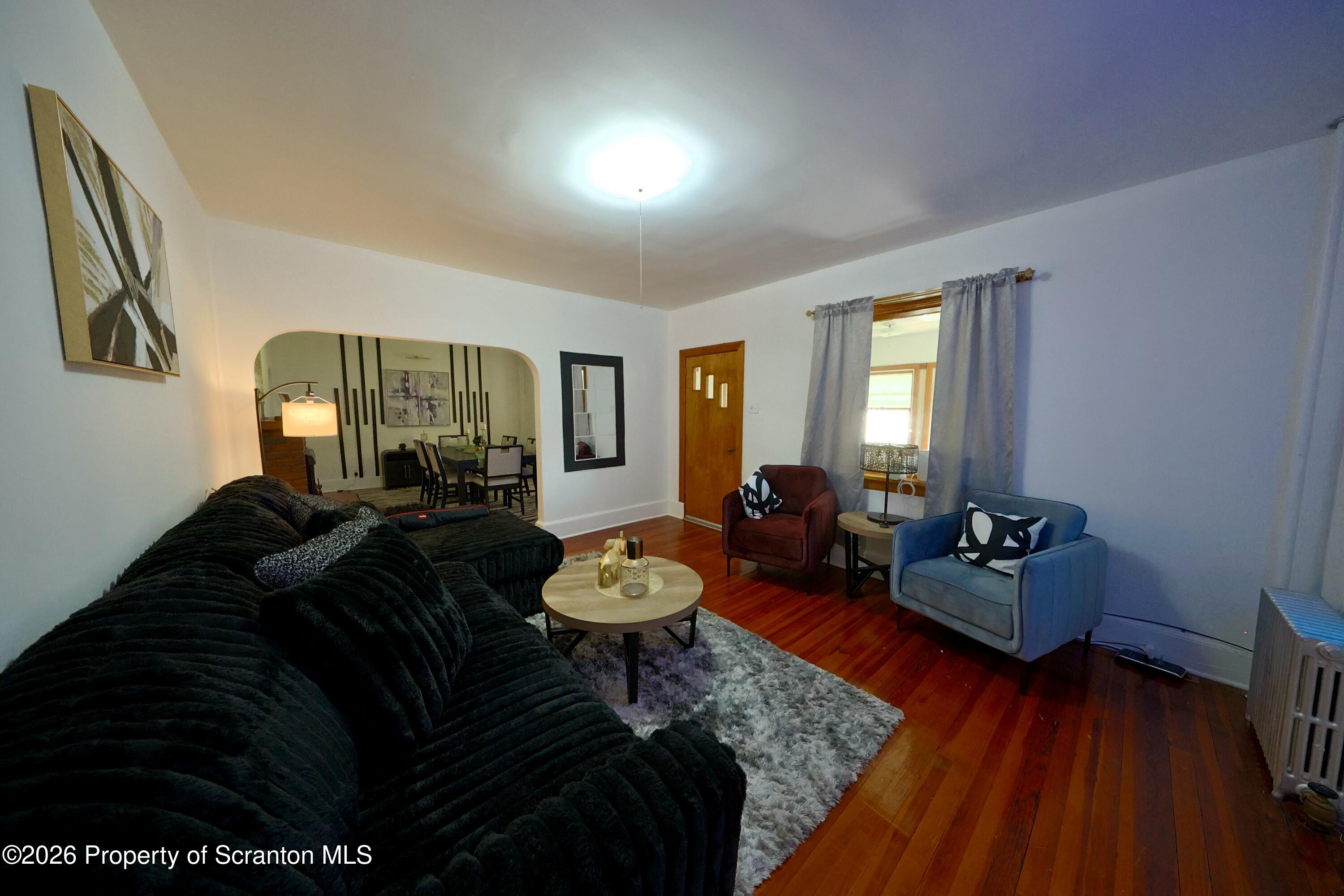 827 Main Street Sugar Notch, PA 18706 - Photo 2 of 25 a living room with furniture and wooden floor