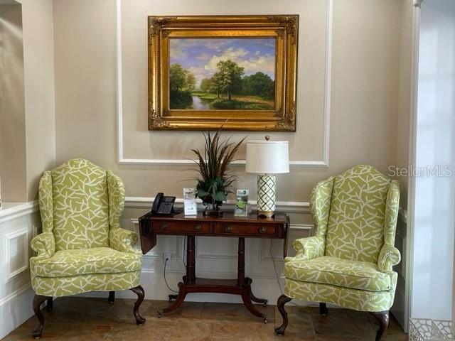 6713 Stone River Road, Unit 206 Bradenton, FL 34203 - Photo 35 of 58 a living room with furniture and a potted plant
