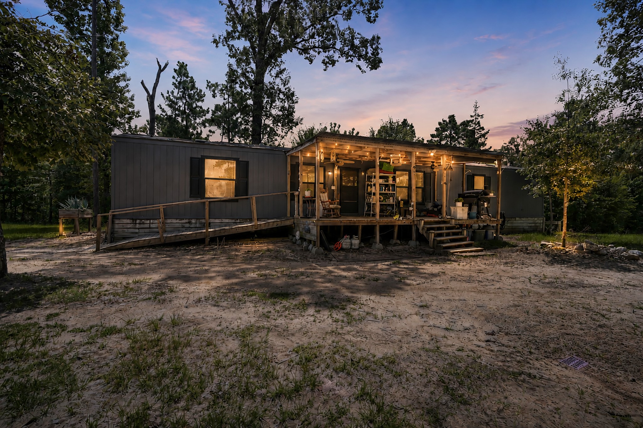 400 Raven Hill Road Oakhurst, TX 77359 - Photo 2 of 45 a view of a house with a yard and furniture