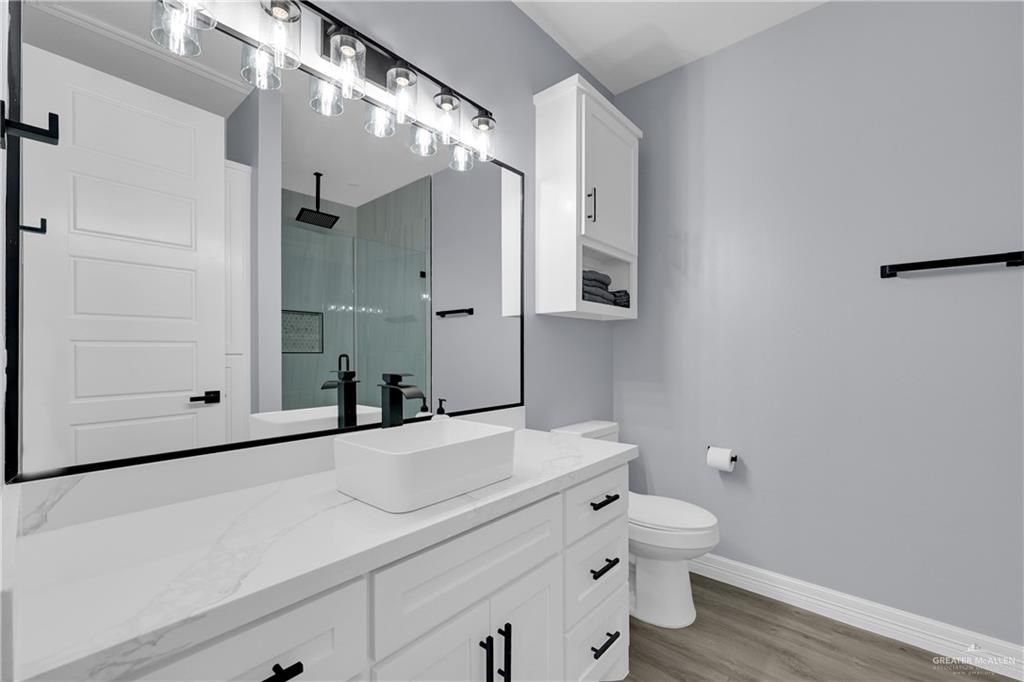 600 West Seminole Avenue Pharr, TX 78577 - Photo 14 of 17 a bathroom with a sink a toilet and shower