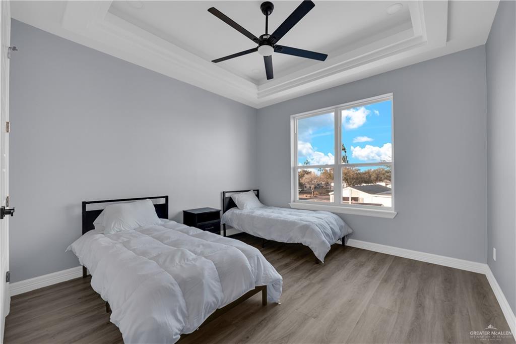 600 West Seminole Avenue Pharr, TX 78577 - Photo 15 of 17 a bedroom with two beds and a window