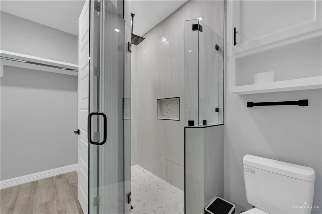 600 West Seminole Avenue Pharr, TX 78577 - Photo 10 of 17 a bathroom with a shower and toilet