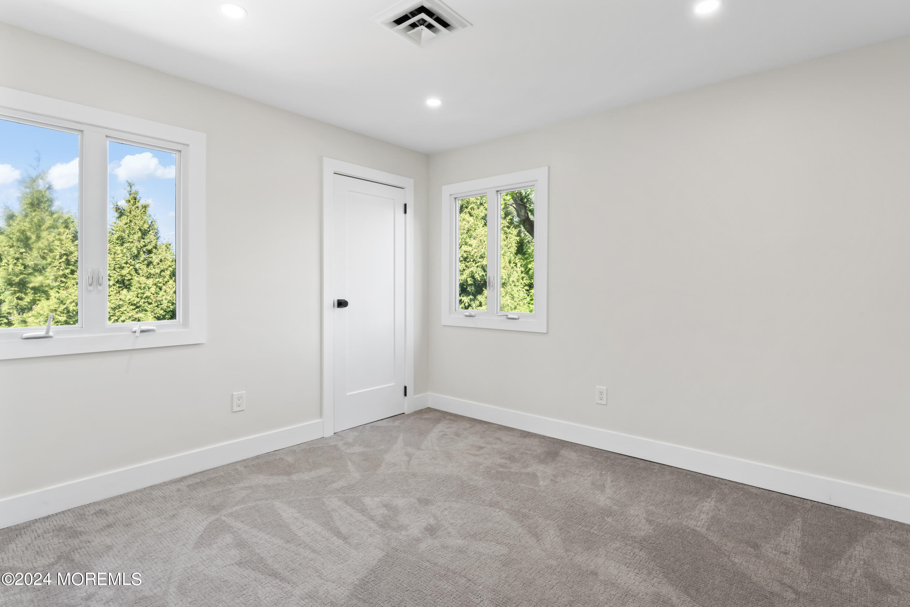 90 Riverview Avenue Neptune, NJ 07753 - Photo 18 of 31 wooden floor in an empty room with a window