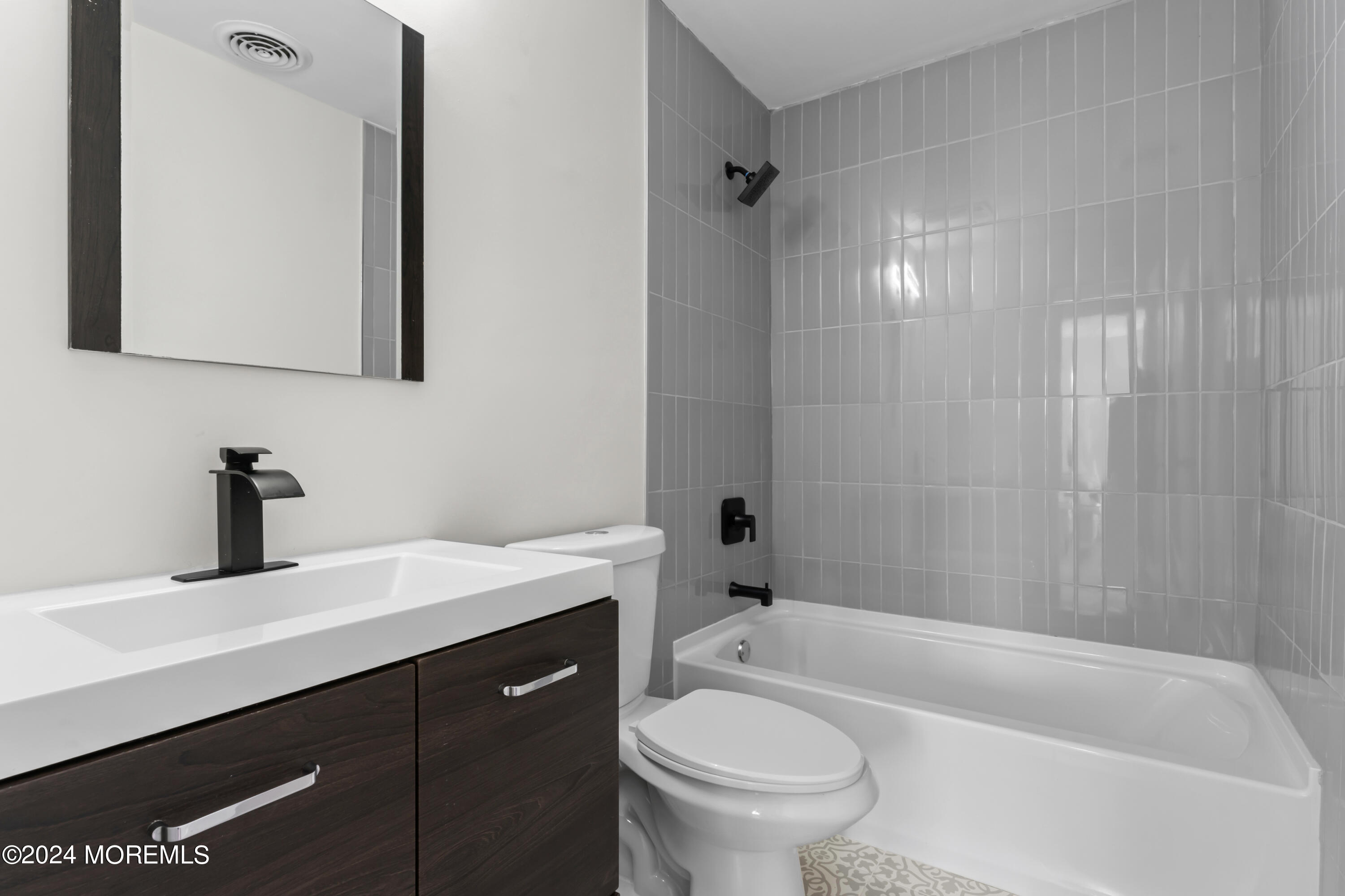 90 Riverview Avenue Neptune, NJ 07753 - Photo 21 of 31 a bathroom with a sink a toilet and bathtub