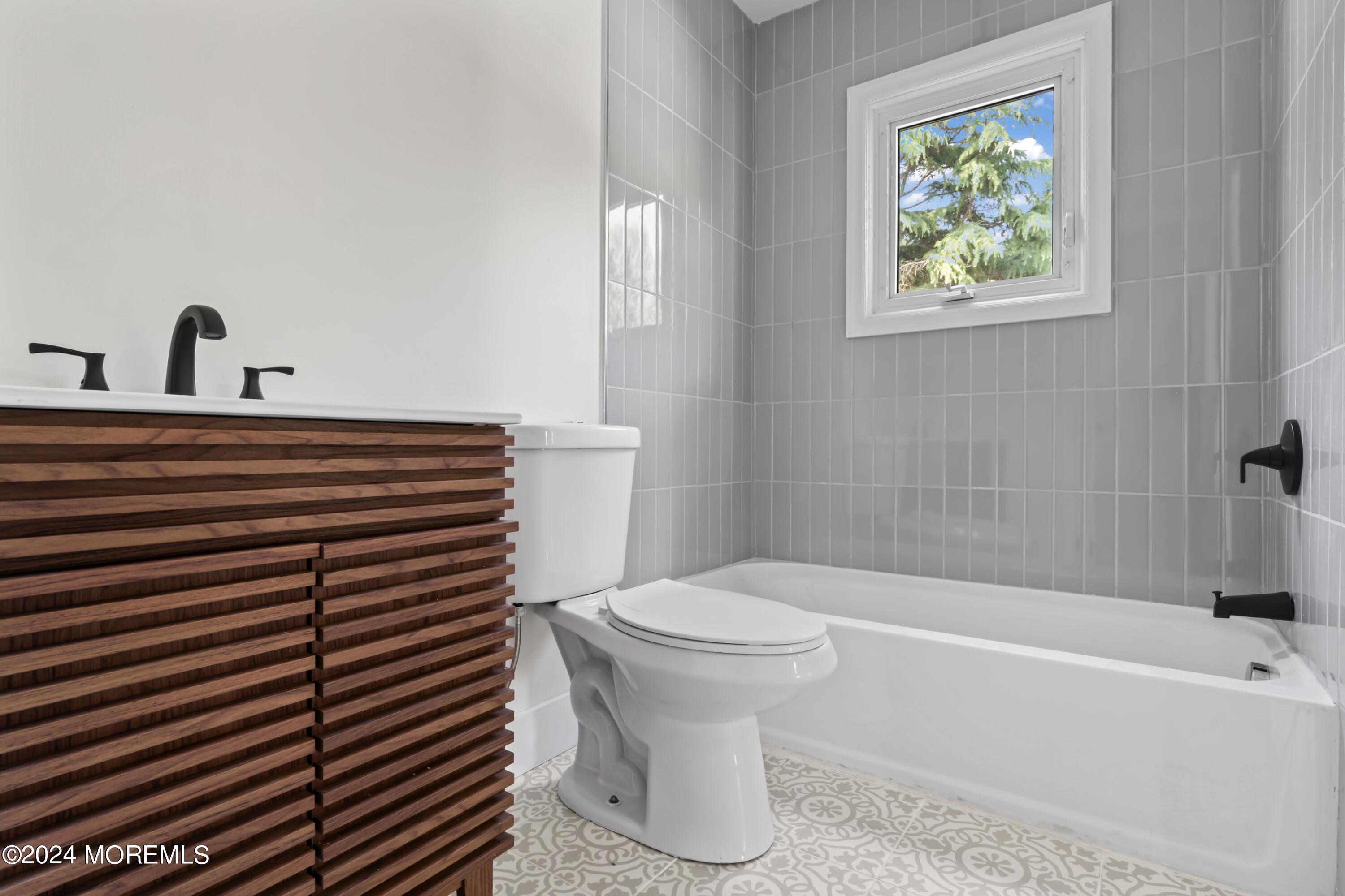 90 Riverview Avenue Neptune, NJ 07753 - Photo 22 of 31 a bathroom with a sink and a bathtub