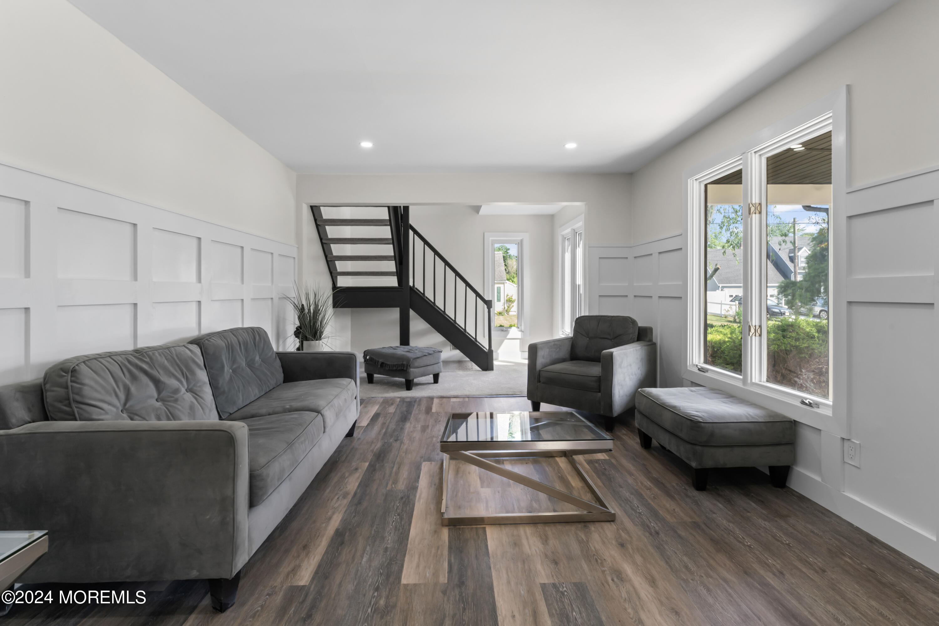 90 Riverview Avenue Neptune, NJ 07753 - Photo 7 of 31 a living room with furniture and a large window