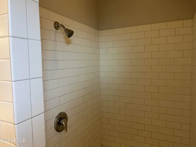 a white toilet sitting in a bathroom next to a sink