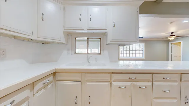 a view of hallway with wooden floor