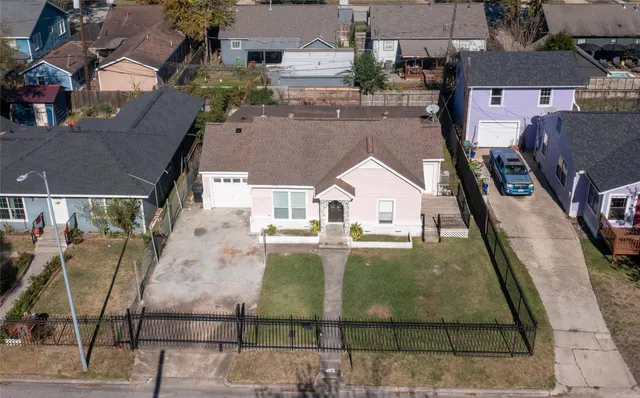 a kitchen with wooden floors and white appliances