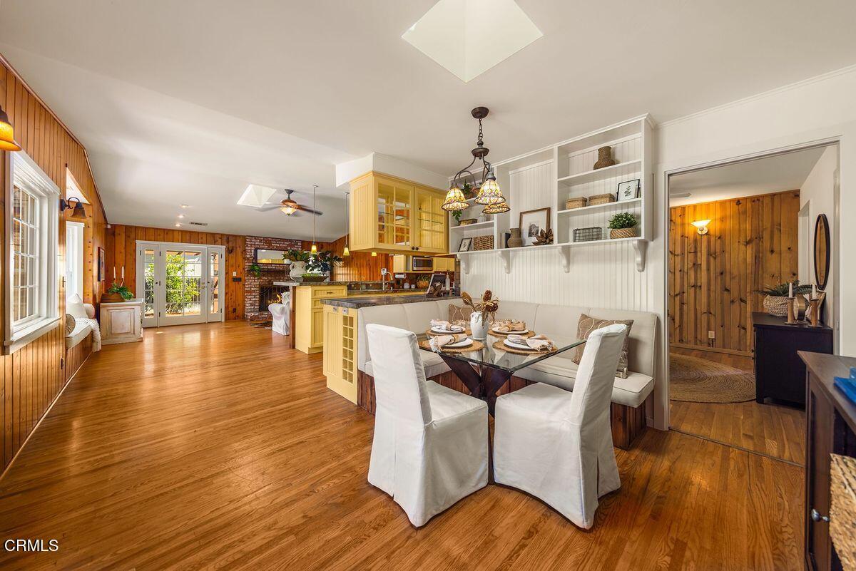 1010 Fairview Road Ojai, CA 93023 - Photo 14 of 24 a dining room with furniture entryway and wooden floor
