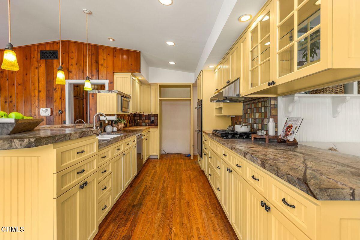 1010 Fairview Road Ojai, CA 93023 - Photo 15 of 24 a large kitchen with stainless steel appliances granite countertop a large stove top oven a sink and dishwasher