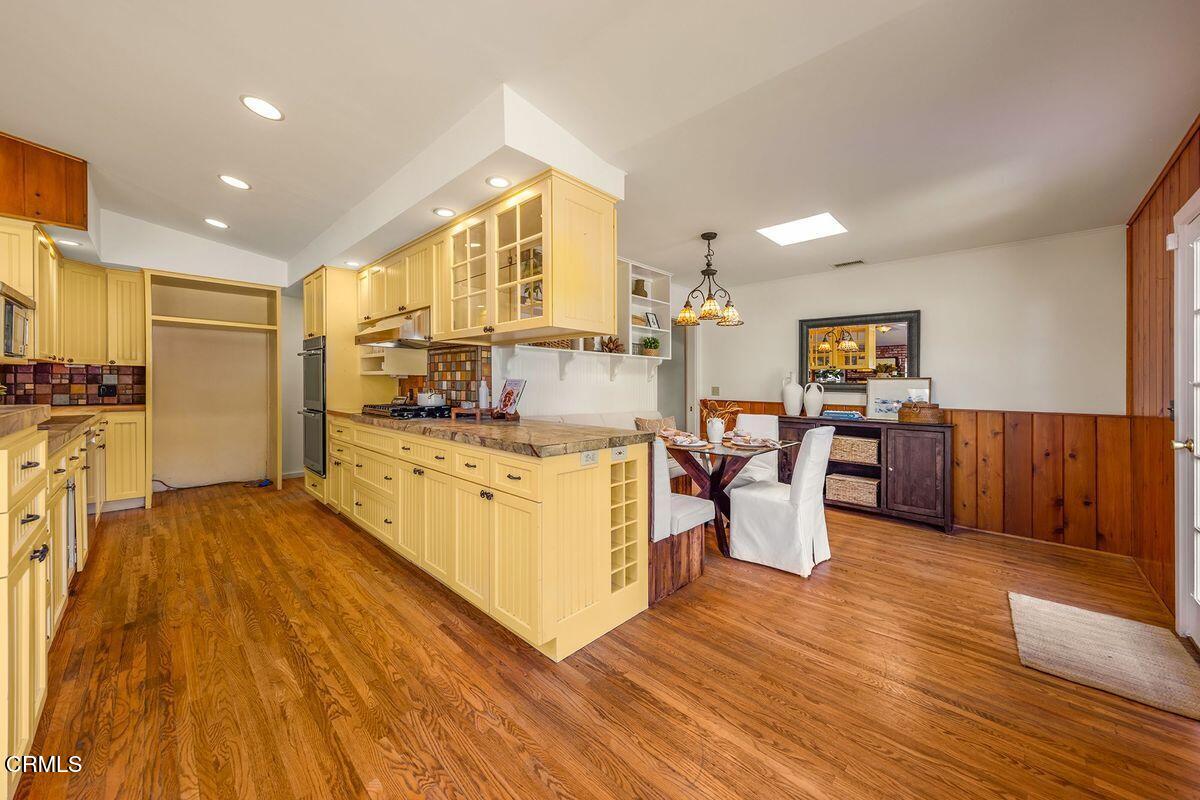 1010 Fairview Road Ojai, CA 93023 - Photo 16 of 24 a view of kitchen with cabinets and wooden floor