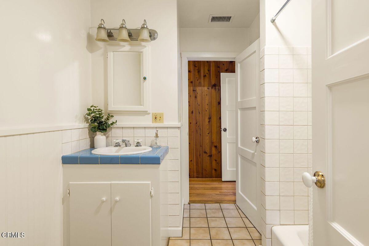 1010 Fairview Road Ojai, CA 93023 - Photo 22 of 24 a bathroom with a sink a mirror and shower