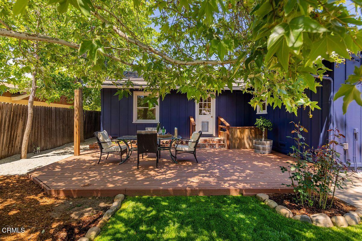 1010 Fairview Road Ojai, CA 93023 - Photo 5 of 24 a view of a backyard with table and chairs and a large tree