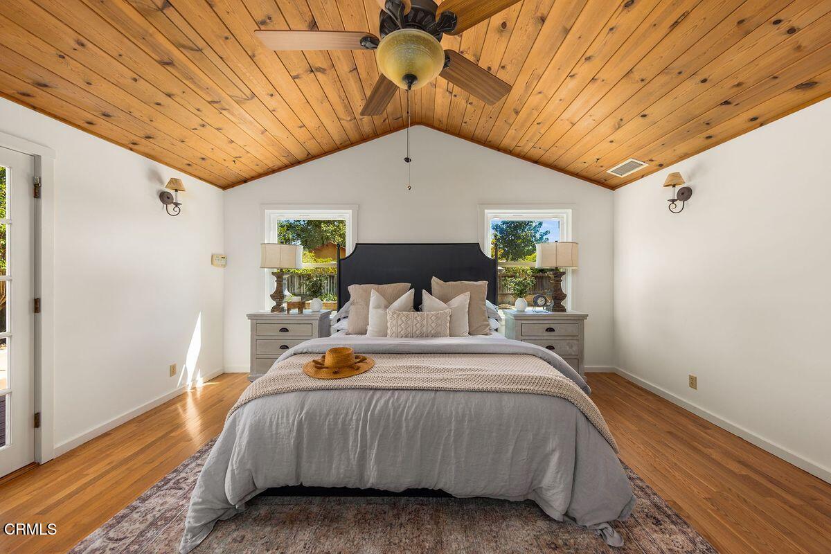 1010 Fairview Road Ojai, CA 93023 - Photo 9 of 24 a bedroom with a bed and wooden floor