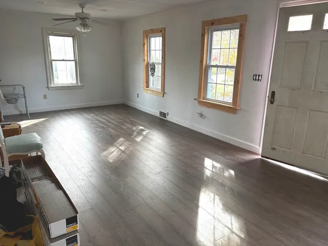 a view of a kitchen with workspace and a window