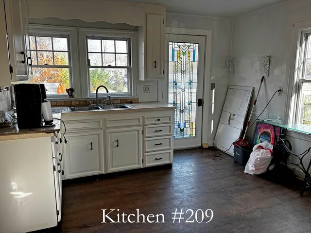 a spacious bathroom with double vanity and a window