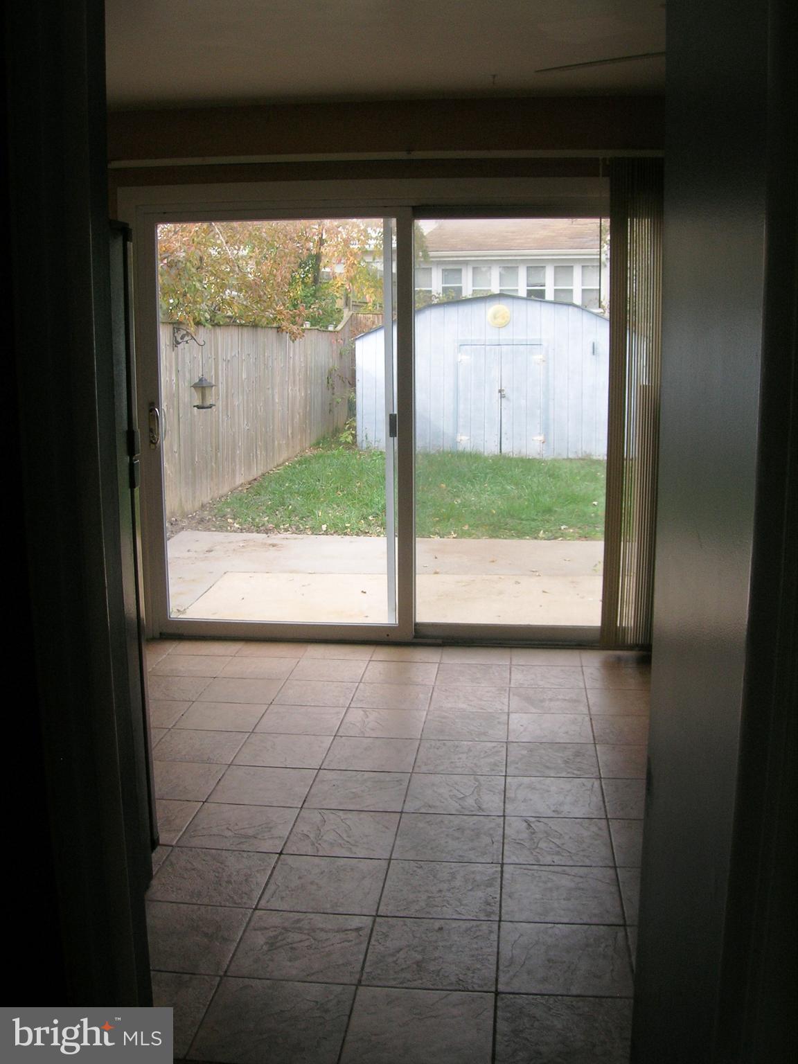 90 Haverhill Road Joppa, MD 21085 - Photo 14 of 31 a view of empty room with wooden floor and a floor to ceiling window