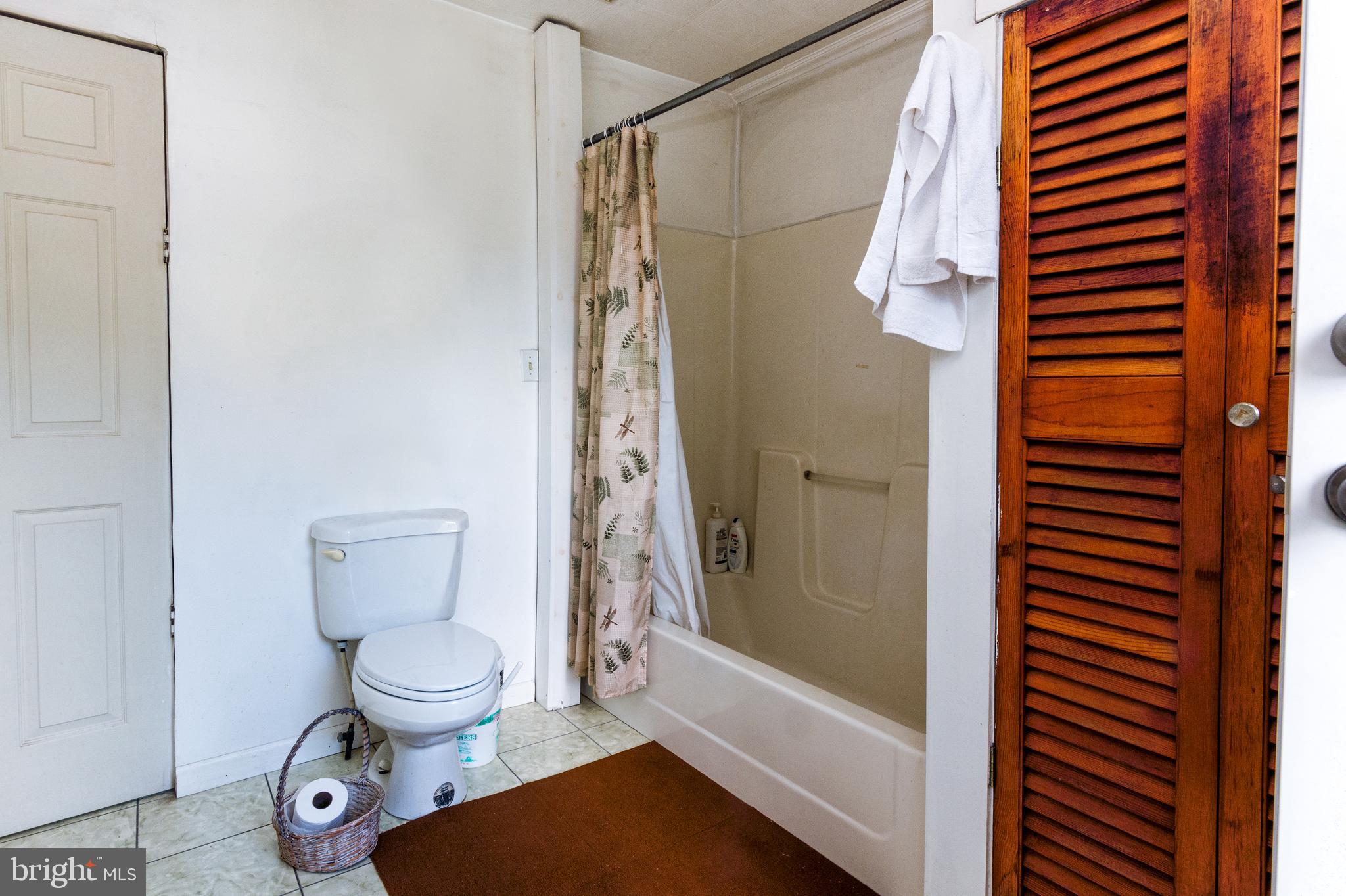 621 Carvel Grove Road Baltimore, MD 21221 - Photo 22 of 25 a bathroom with a toilet and a shower