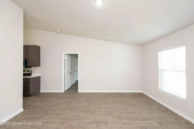 a view of an empty room with a window