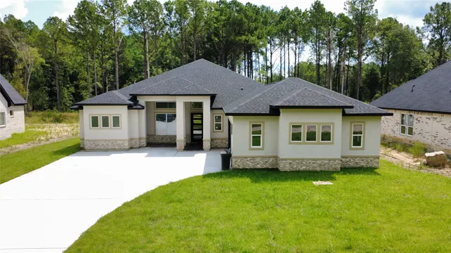 a view of a house with a garden