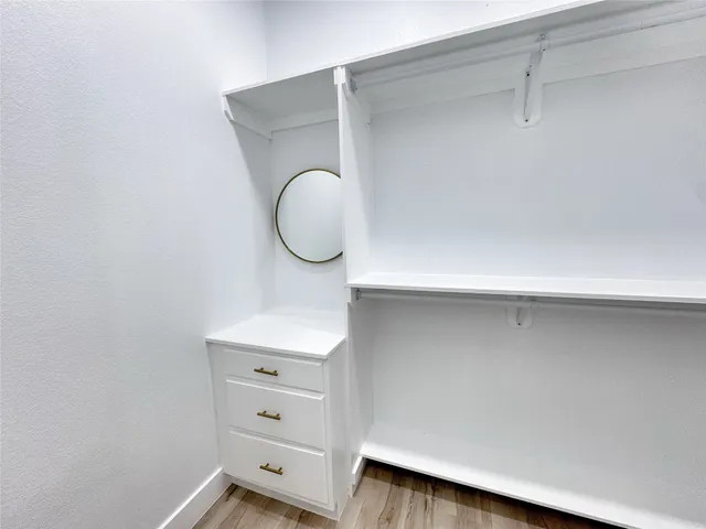 a close view of closet with wooden floor