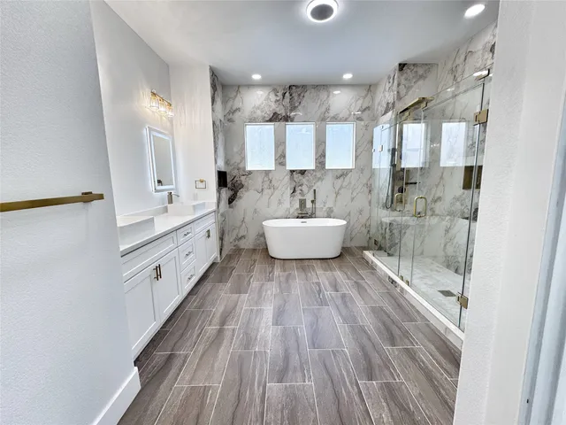 a bathroom with a double vanity sink and mirror