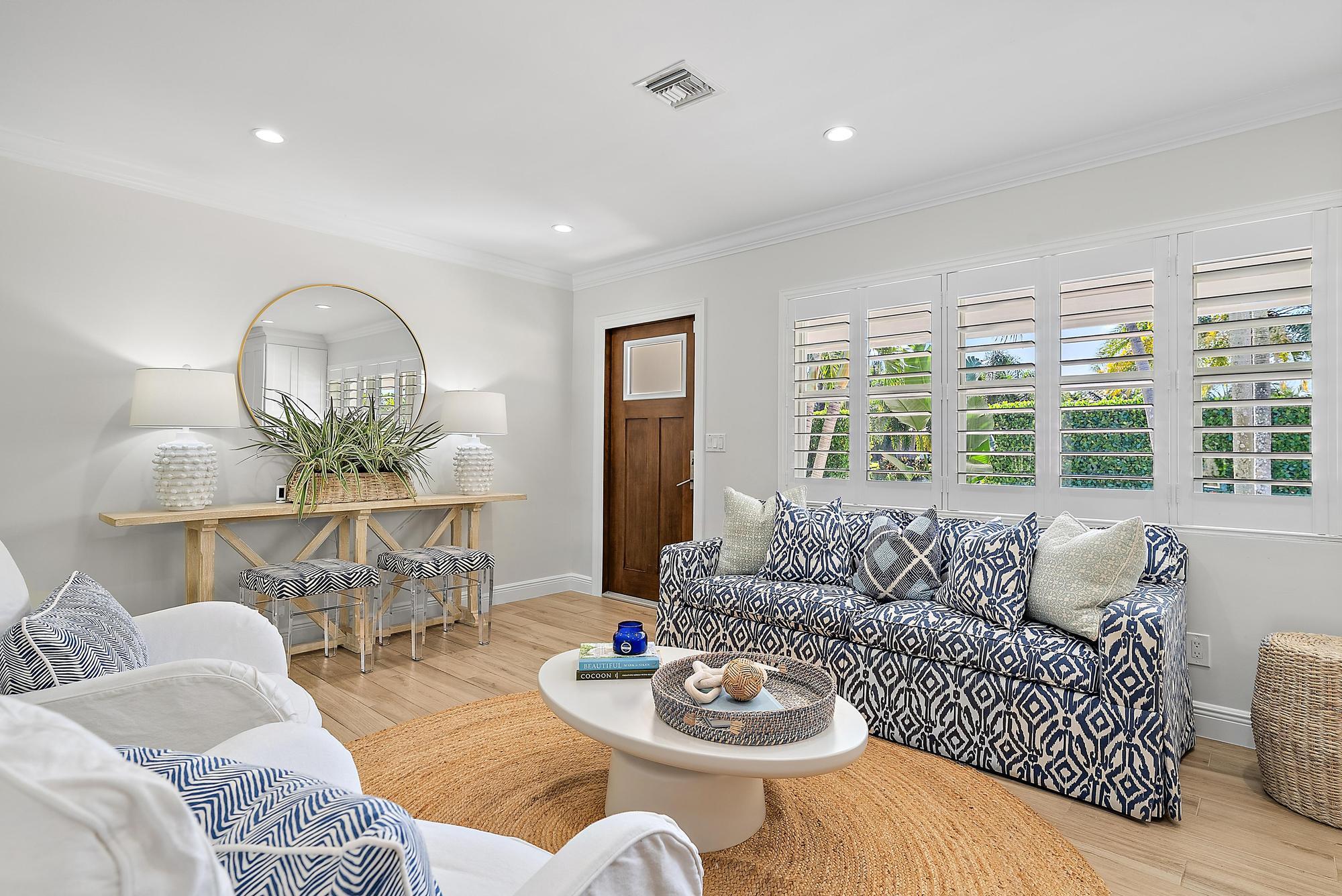 4967 Bimini Road Tequesta, FL 33469 - Photo 13 of 36 a living room with furniture and a large window