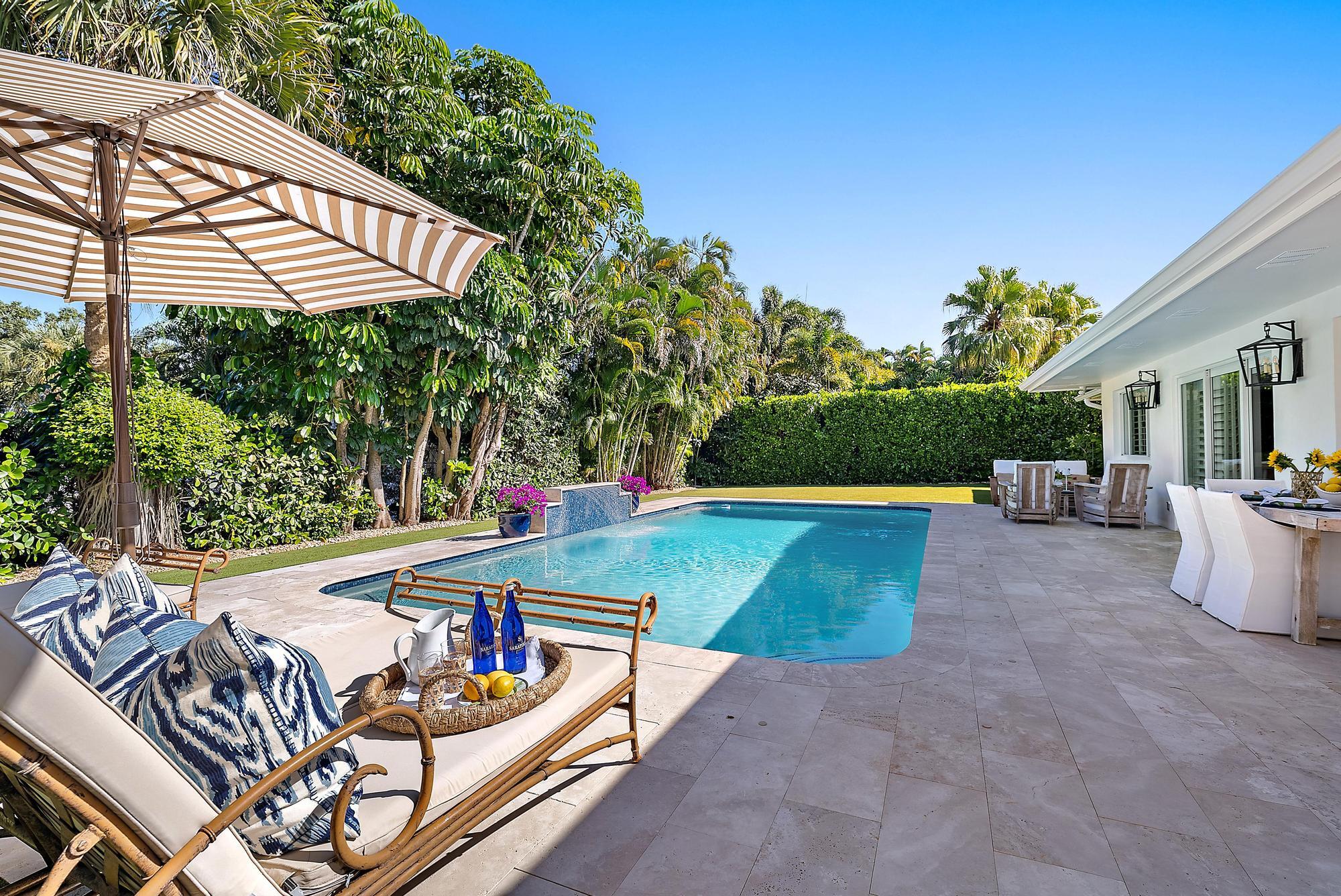 4967 Bimini Road Tequesta, FL 33469 - Photo 17 of 36 a view of a chairs and tables in the patio