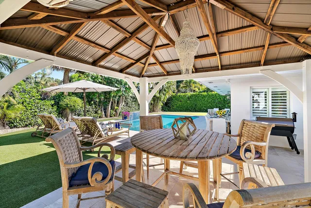a patio with a patio table and chairs
