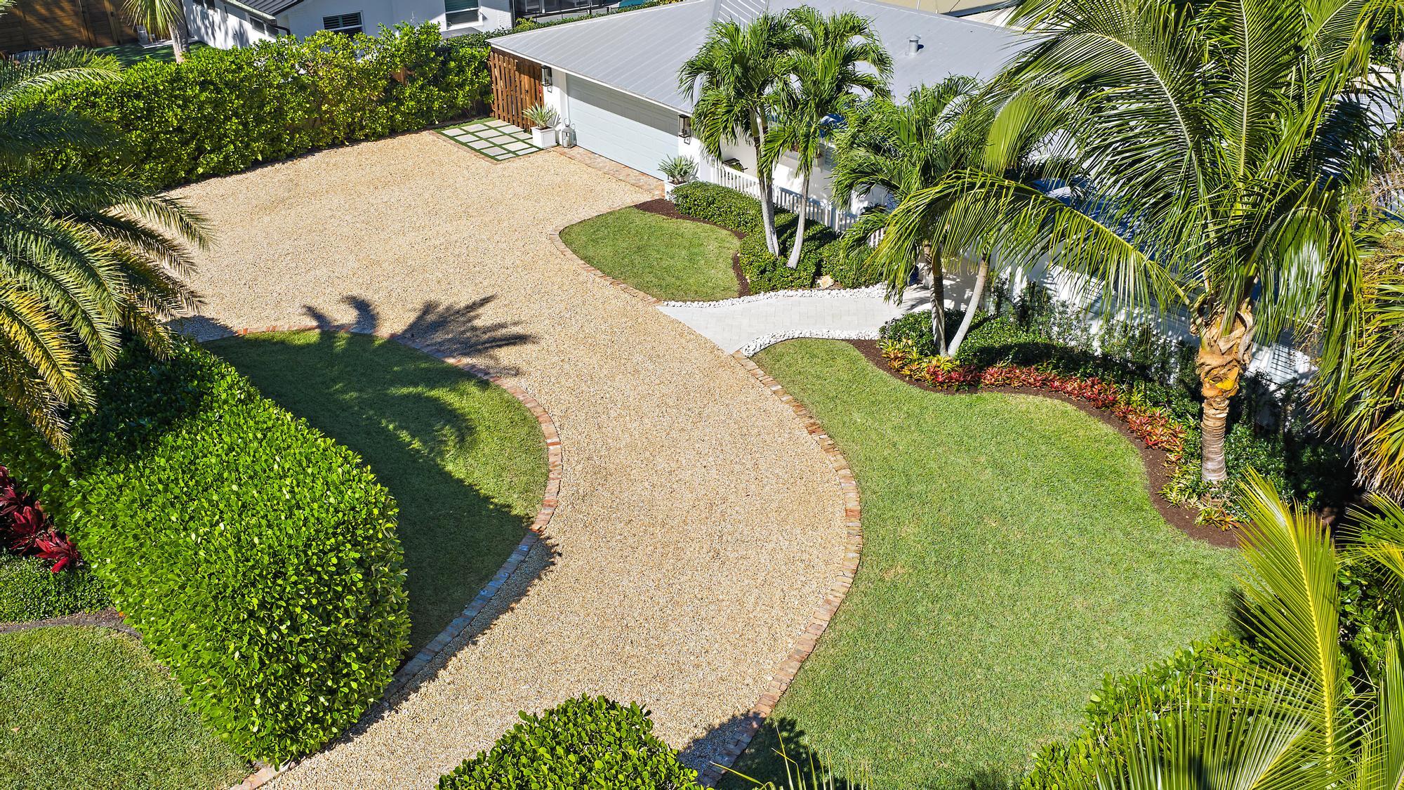 4967 Bimini Road Tequesta, FL 33469 - Photo 2 of 36 a view of a swimming pool with a yard