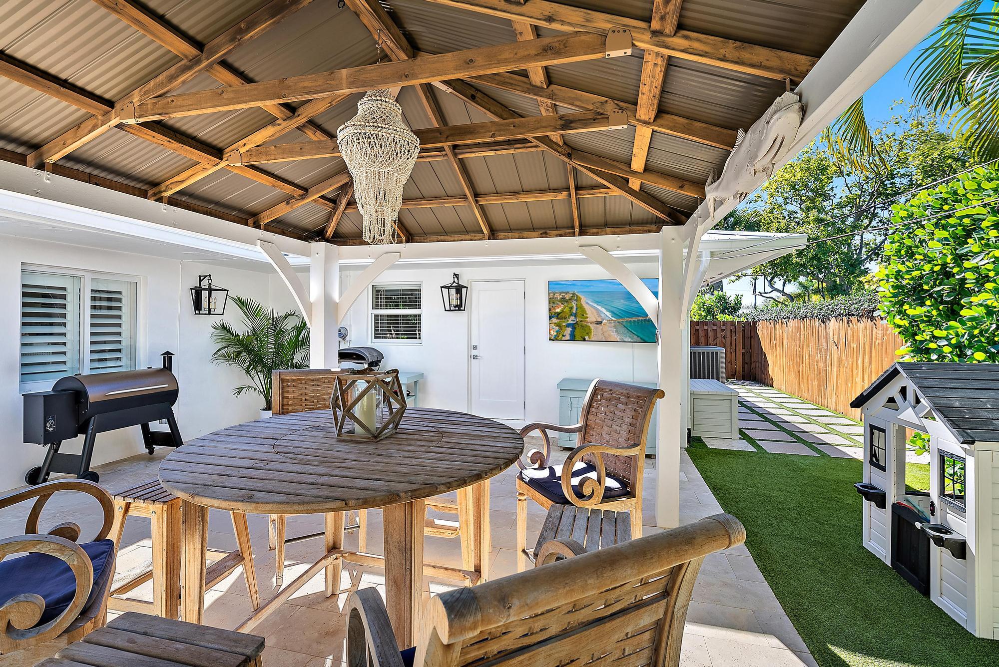 4967 Bimini Road Tequesta, FL 33469 - Photo 21 of 36 a view of outdoor space yard and patio